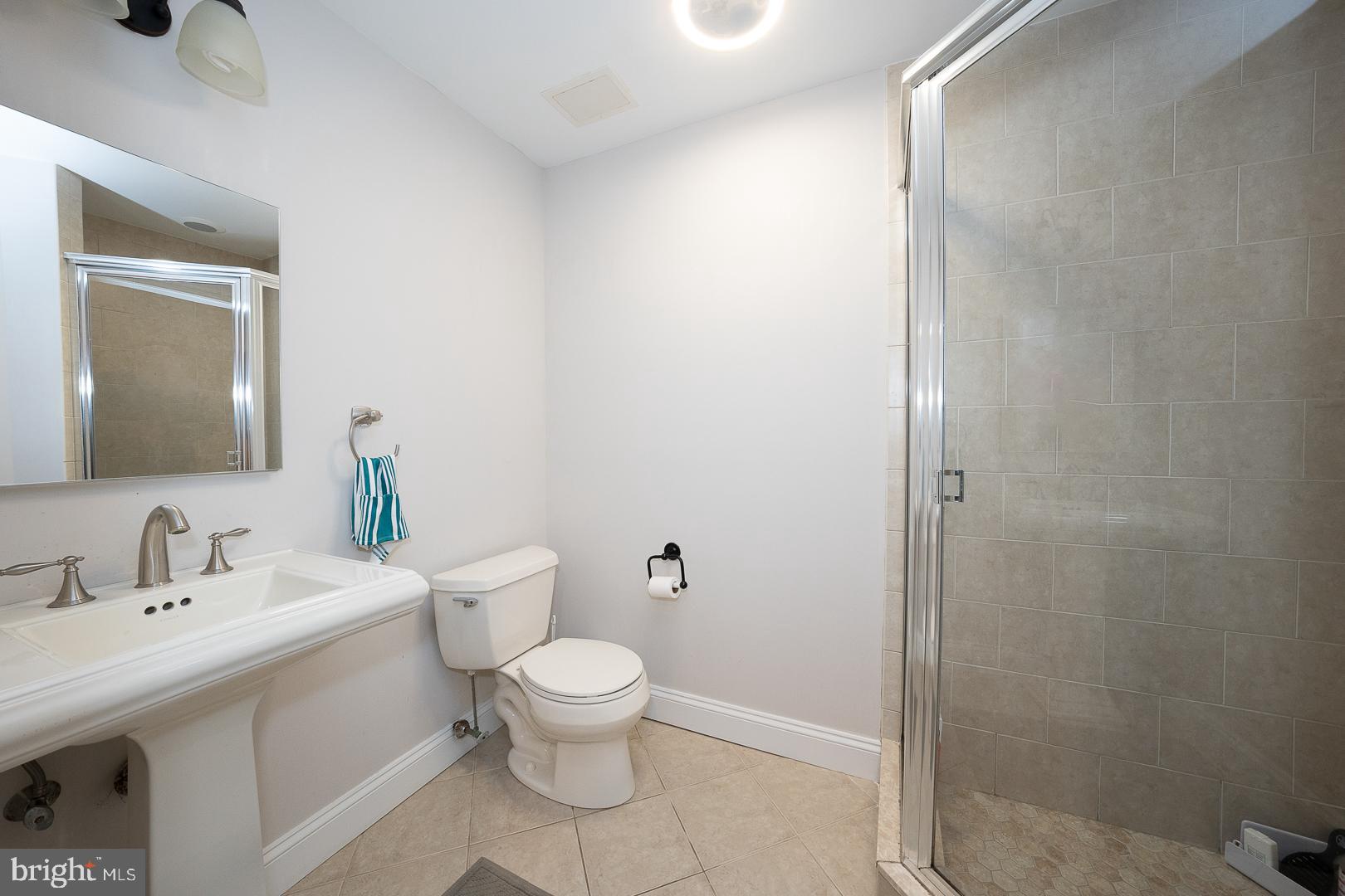 318 Chamounix Road Wayne, PA 19087 - Photo 43 of 55 a white toilet sitting next to a bathroom sink