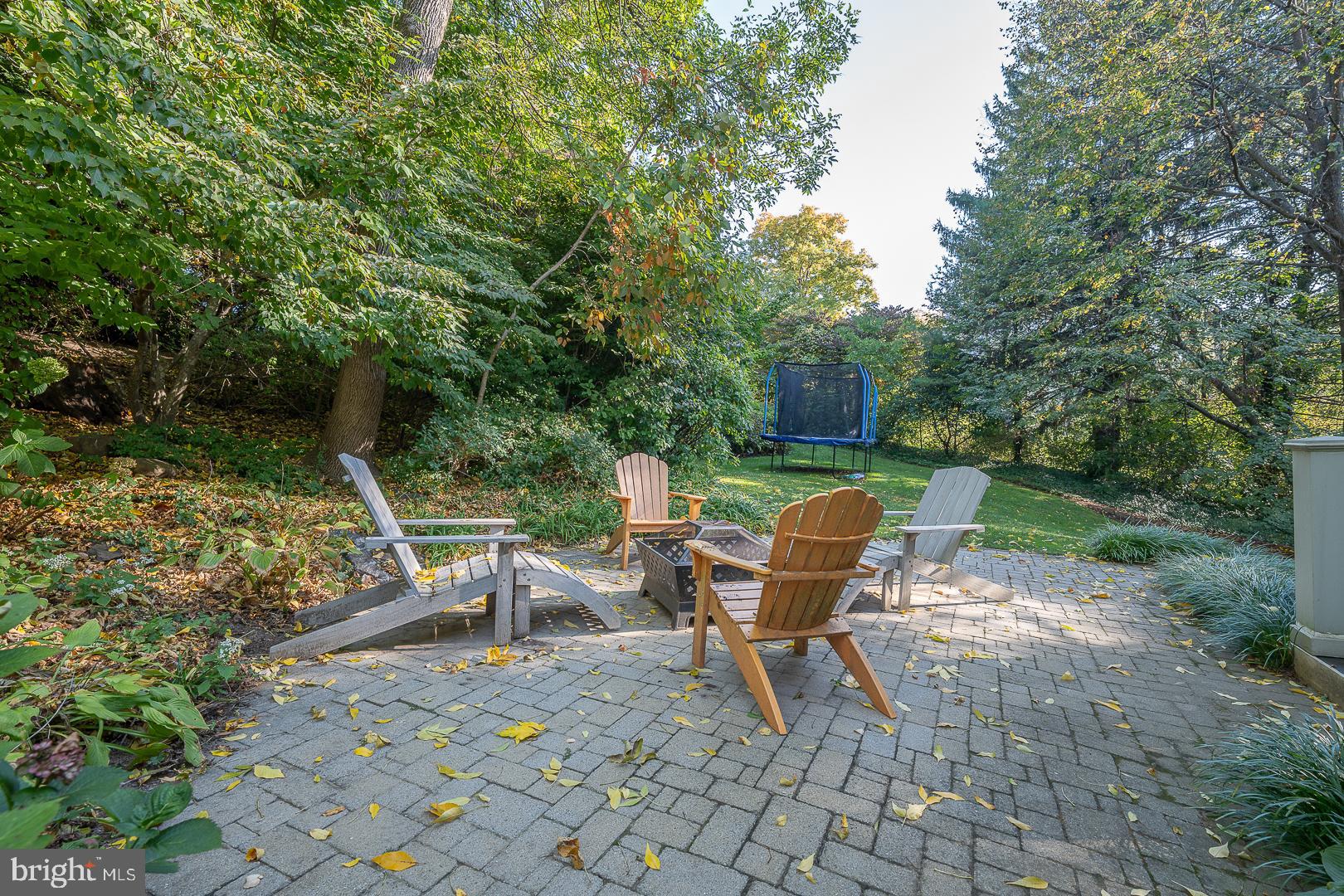 318 Chamounix Road Wayne, PA 19087 - Photo 50 of 55 a view of a chairs and table in backyard