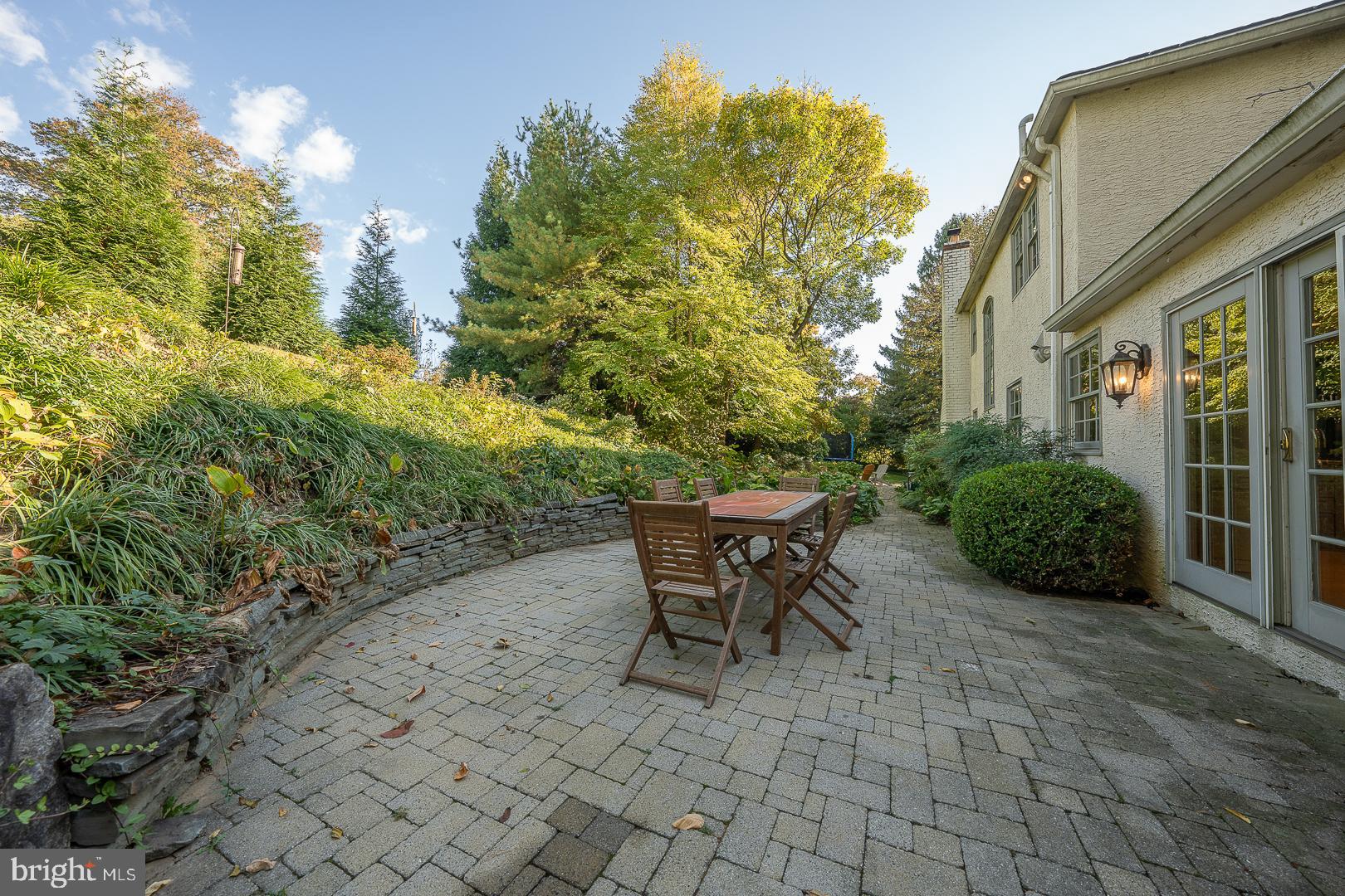 318 Chamounix Road Wayne, PA 19087 - Photo 51 of 55 a view of a patio with table and chairs and potted plants