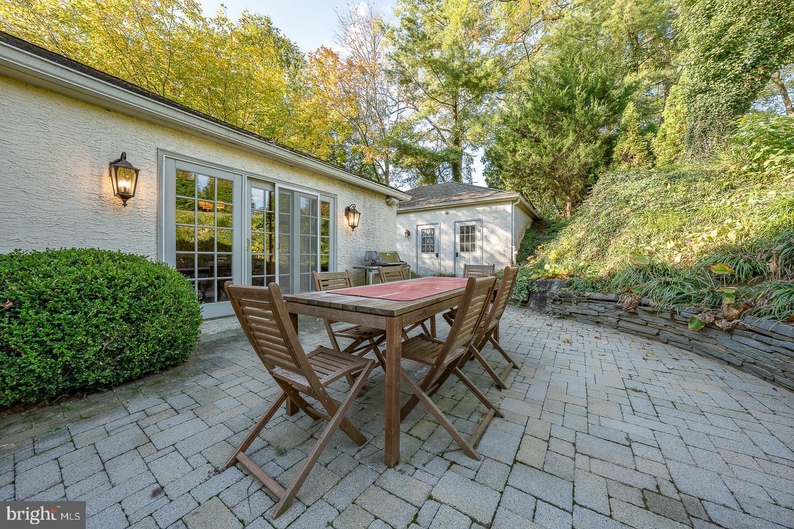 318 Chamounix Road Wayne, PA 19087 - Photo 52 of 55 a patio with table and chairs and potted plants