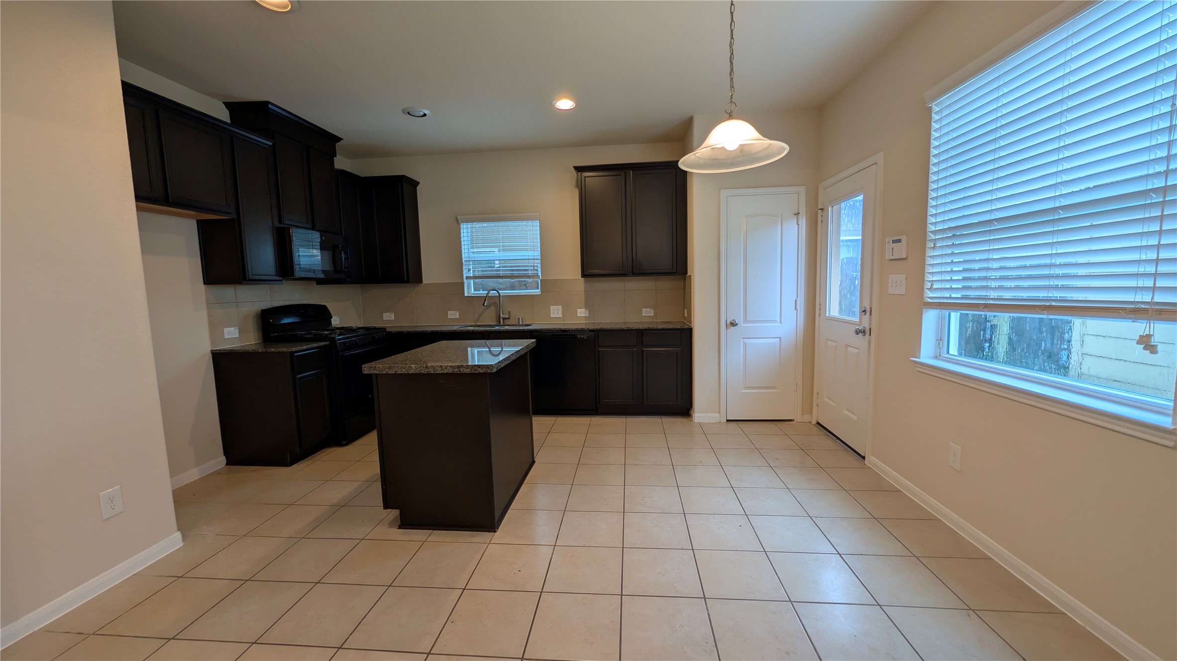 7326 Granite Terrace Lane Houston, TX 77083 - Photo 7 of 39 a kitchen with a cabinets and appliances