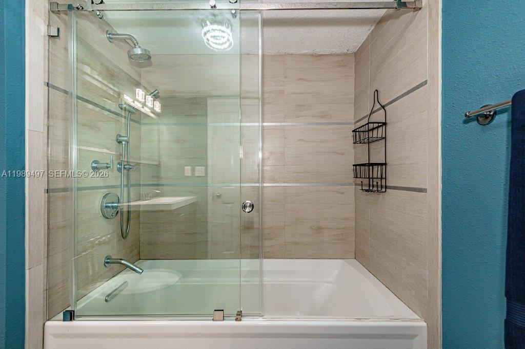 1500 Bay Road, Unit 128S Miami Beach, FL 33139 - Photo 12 of 27 a bathroom with a bathtub