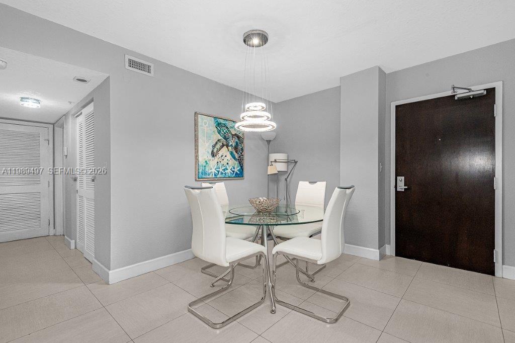 1500 Bay Road, Unit 128S Miami Beach, FL 33139 - Photo 22 of 27 a view of a dining room with furniture