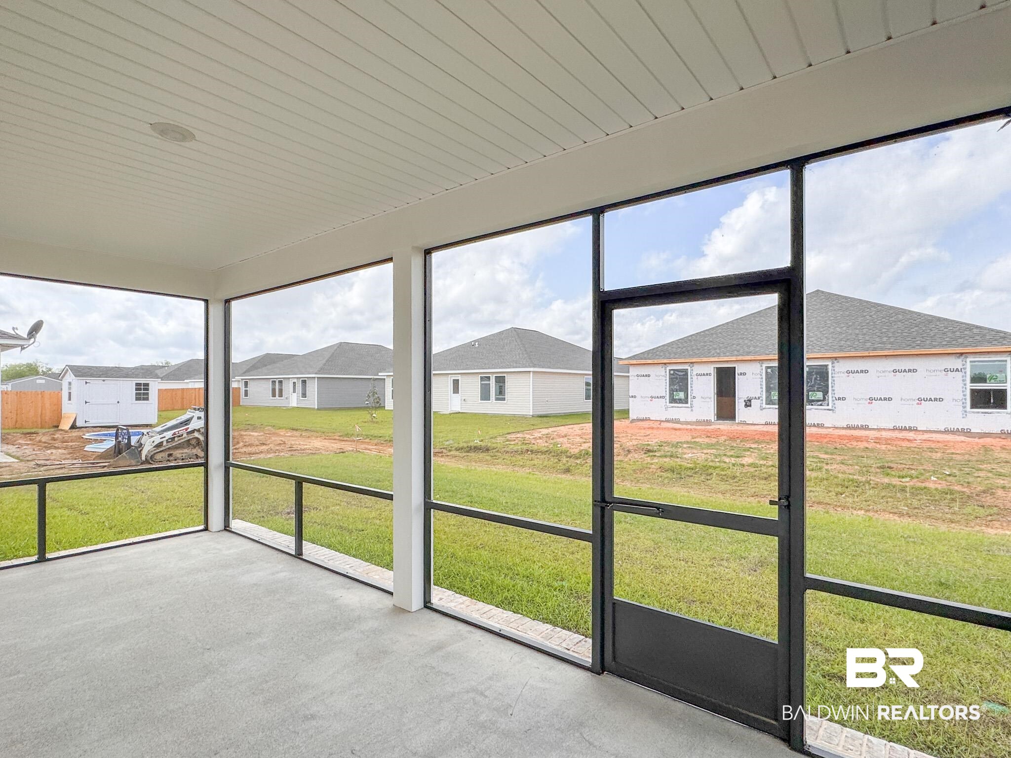 18151 Kent Circle Foley, AL 36535 - Photo 24 of 25 Screened-in porch featuring a concrete slab floor and white tongue-and-groove ceiling