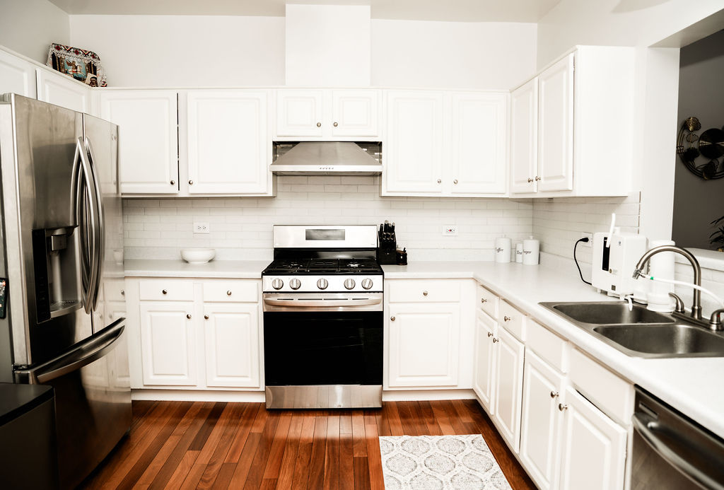 3389 Ravinia Circle Aurora, IL 60504 - Photo 12 of 39 a kitchen with cabinets and stainless steel appliances