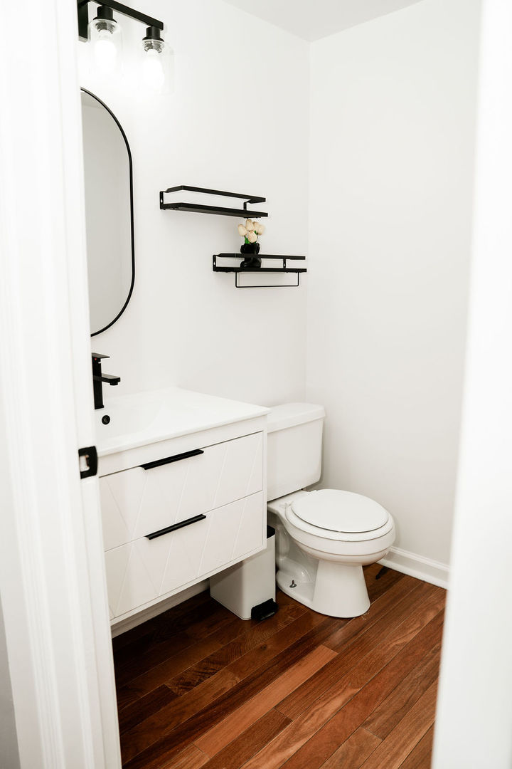 3389 Ravinia Circle Aurora, IL 60504 - Photo 13 of 39 a bathroom with a toilet and a mirror
