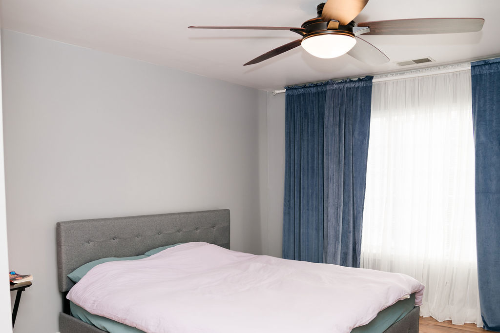 3389 Ravinia Circle Aurora, IL 60504 - Photo 19 of 39 a bed sitting in a bedroom and chandelier fan