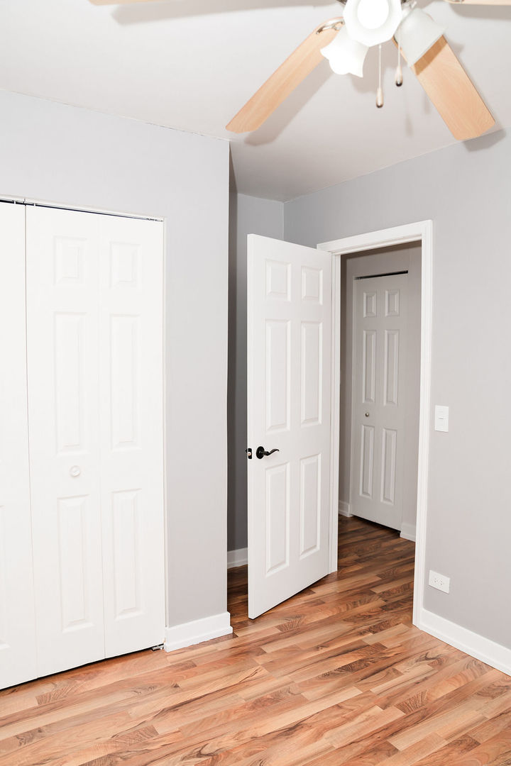 3389 Ravinia Circle Aurora, IL 60504 - Photo 28 of 39 a view of an empty room with wooden floor