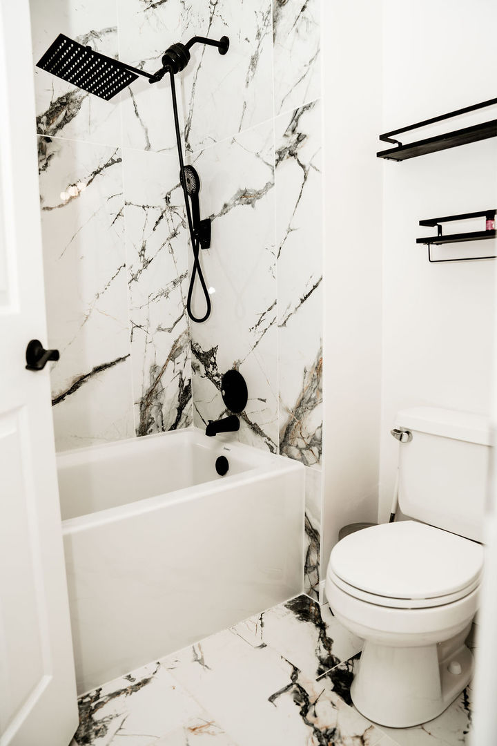 3389 Ravinia Circle Aurora, IL 60504 - Photo 30 of 39 a white toilet sitting next to a bath tub