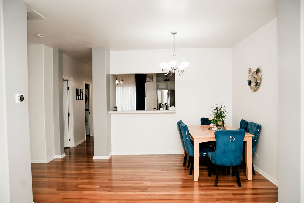 3389 Ravinia Circle Aurora, IL 60504 - Photo 6 of 39 a view of a dining room with furniture and wooden floor