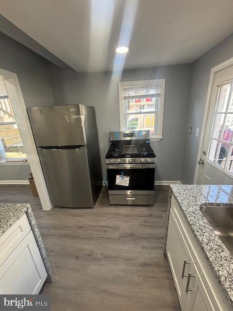 3802 Parkside Drive Baltimore, MD 21206 - Photo 7 of 11 a kitchen with a refrigerator and a stove
