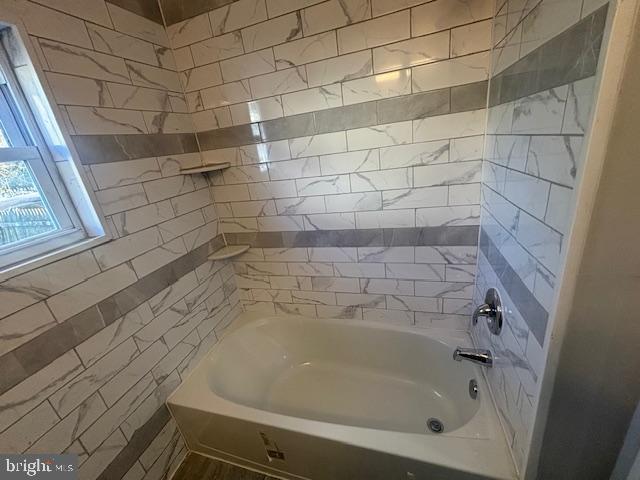 3802 Parkside Drive Baltimore, MD 21206 - Photo 8 of 11 a bathroom with a bathtub