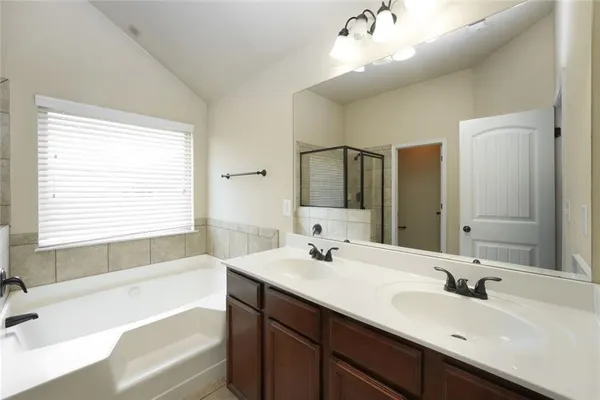 an empty room with chandelier fan