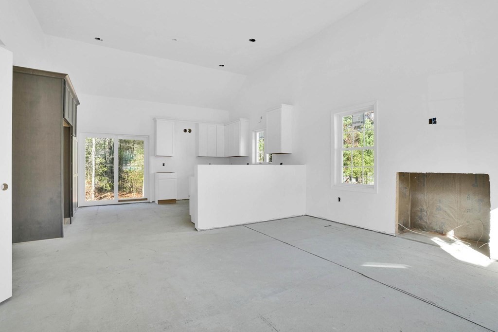 964 Stonegate Landing Dighton, MA 02764 - Photo 8 of 17 a view of a livingroom with a kitchen and a window