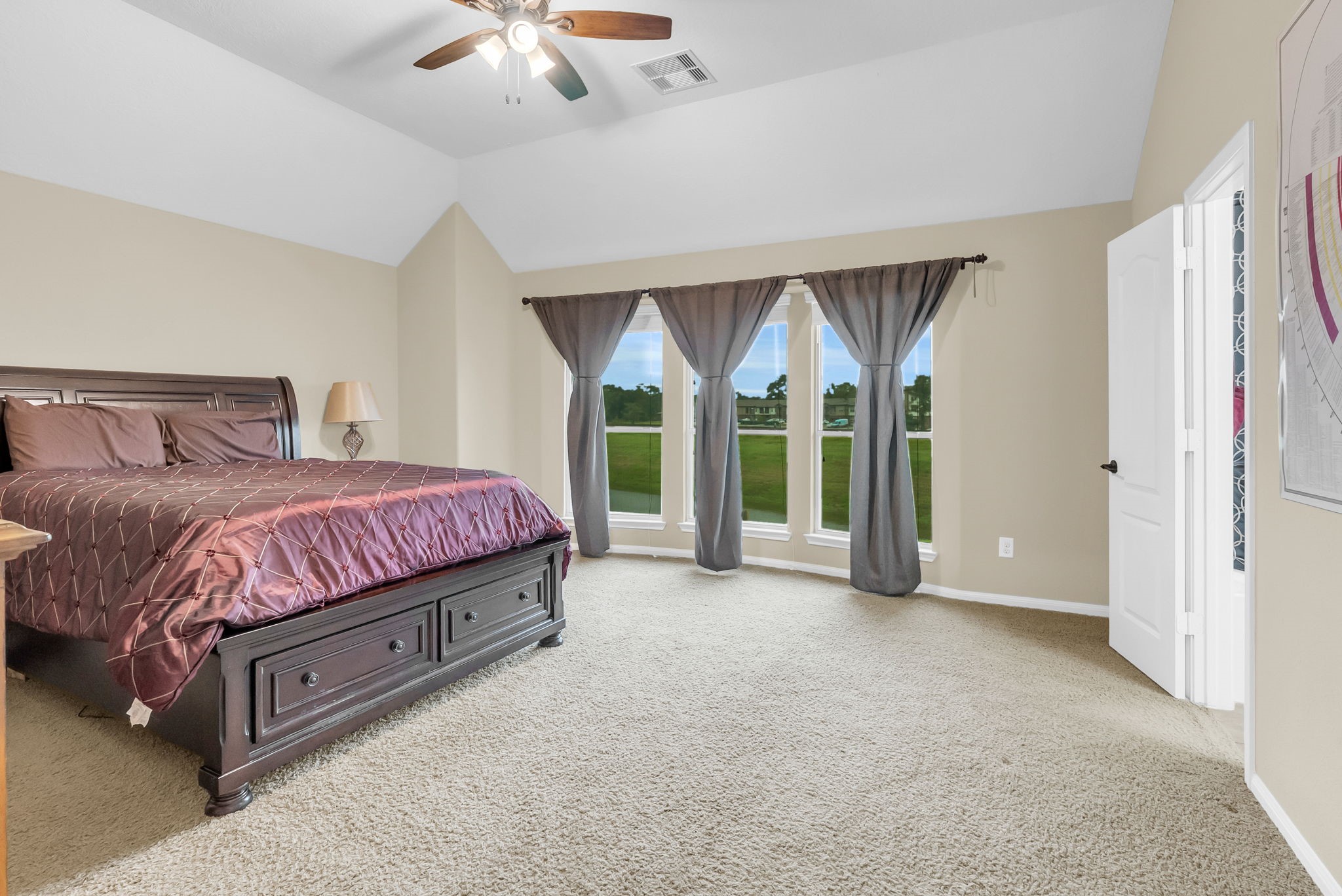 16619 Dover Mills Drive Spring, TX 77379 - Photo 26 of 49 a spacious bedroom with a bed and a large window