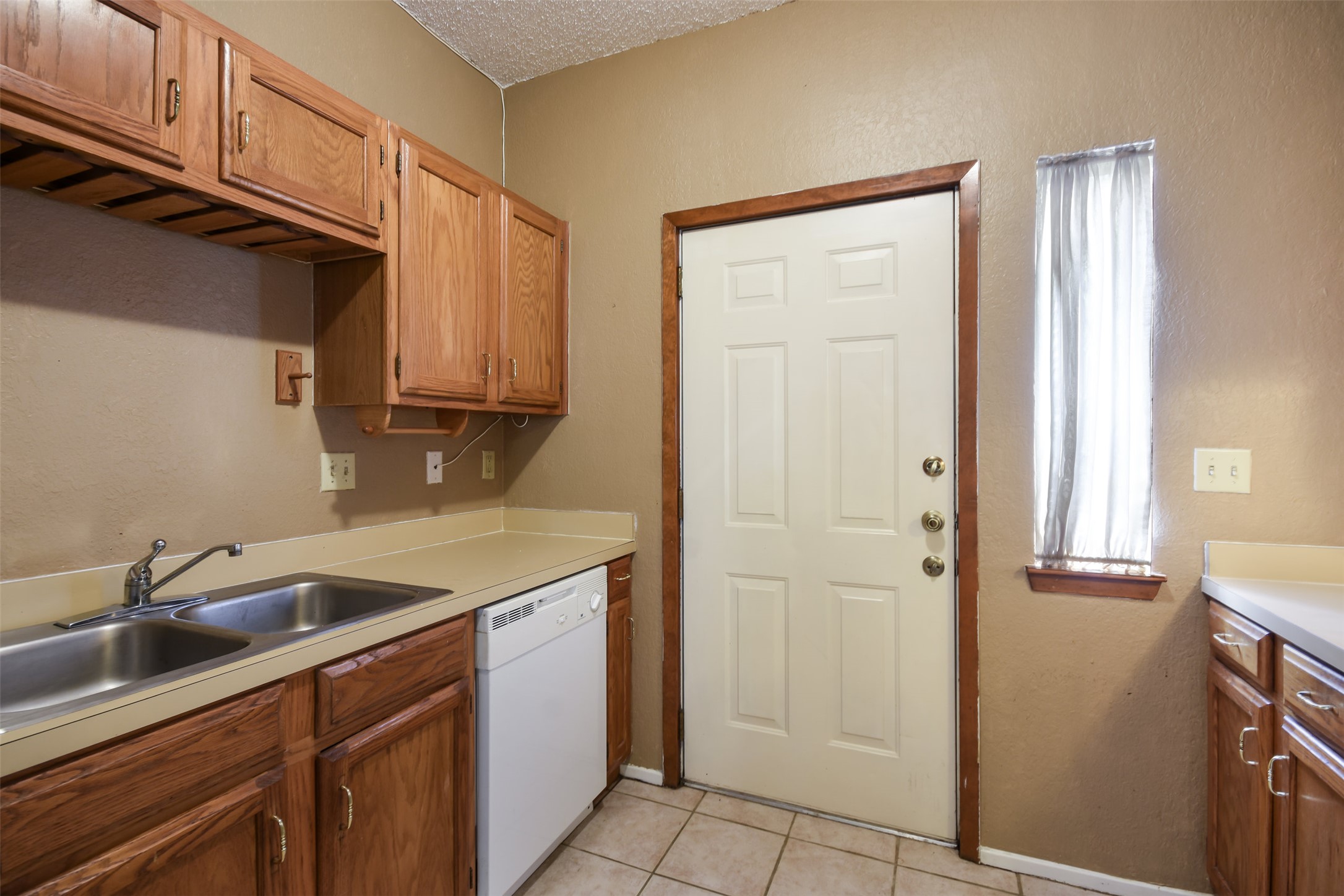 3004 Speedway, Unit 2 Austin, TX 78705 - Photo 12 of 20 a kitchen with a sink cabinets and stainless steel appliances