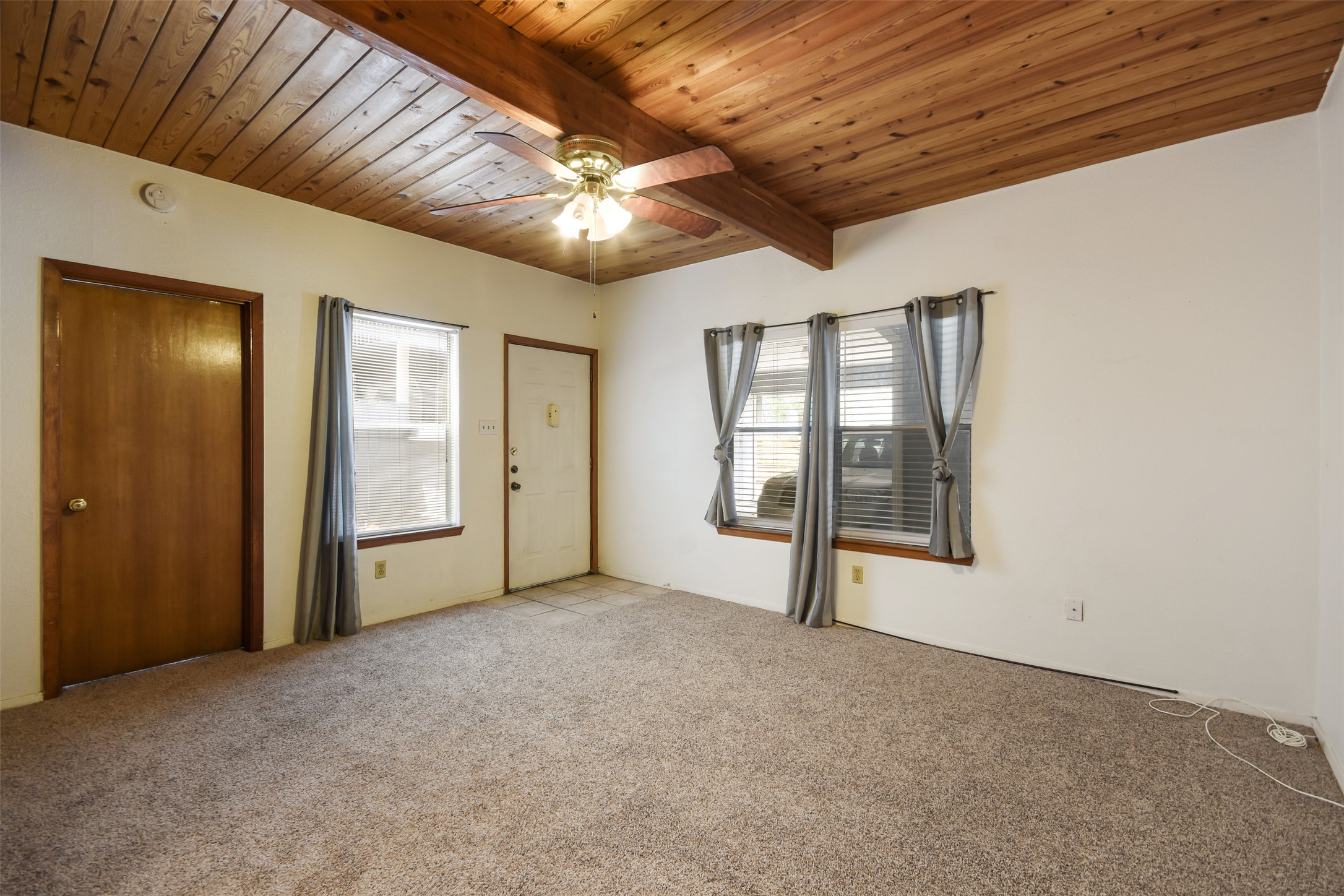 3004 Speedway, Unit 2 Austin, TX 78705 - Photo 8 of 20 en empty room with windows and ceiling fan