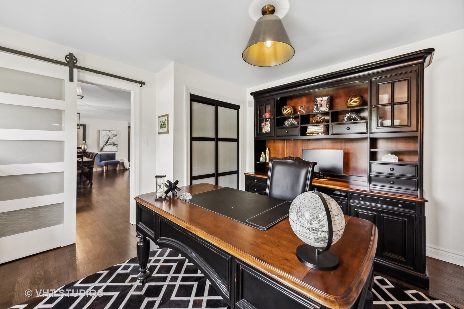 8460 Dolfor Cove Burr Ridge, IL 60527 - Photo 13 of 32 a room with wooden floor and furniture