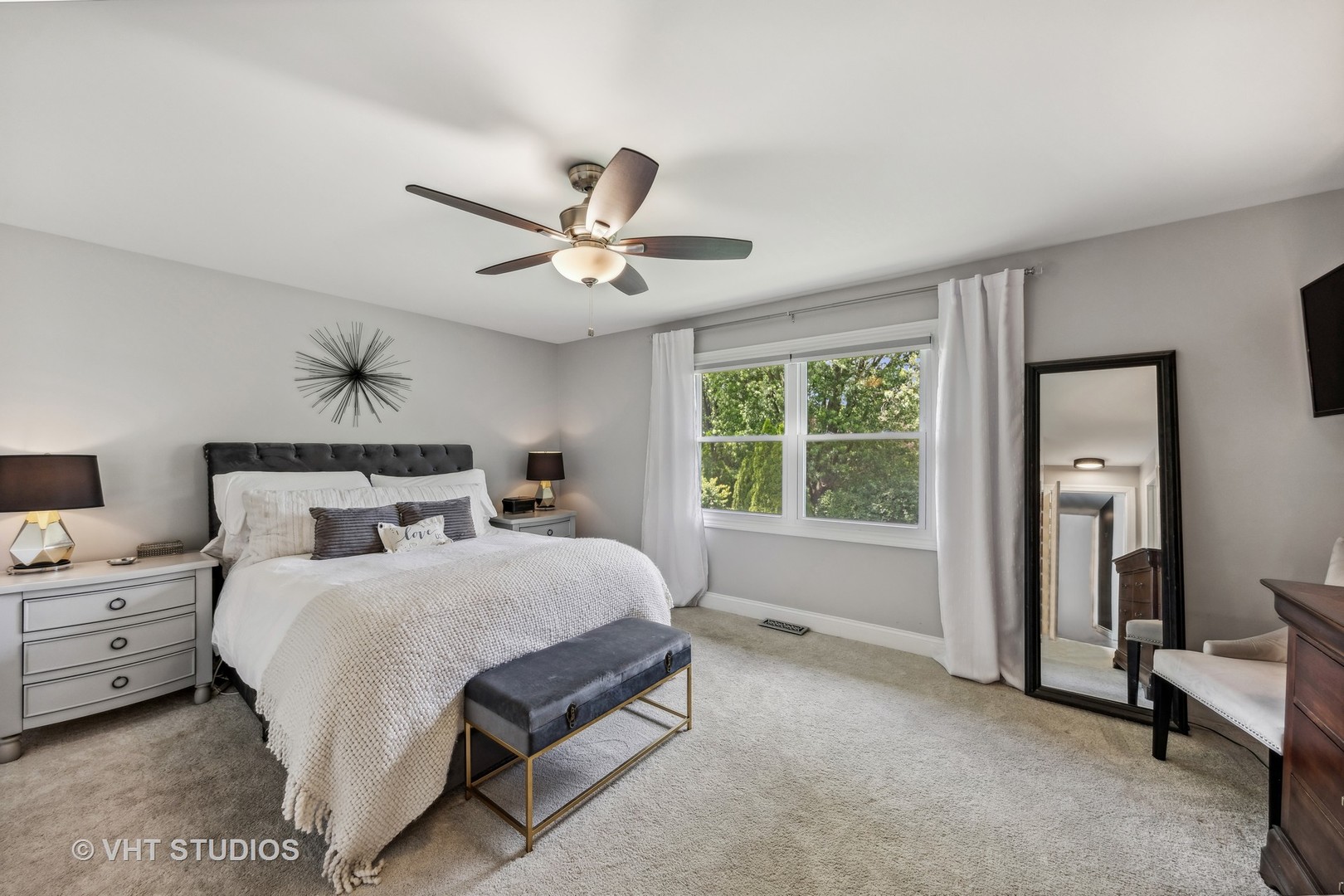 8460 Dolfor Cove Burr Ridge, IL 60527 - Photo 14 of 32 a bedroom with a bed a chandelier and a window