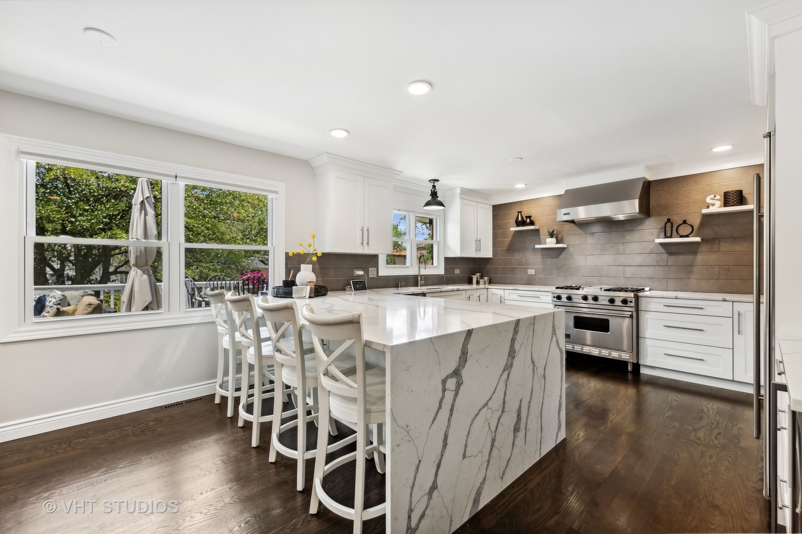 8460 Dolfor Cove Burr Ridge, IL 60527 - Photo 2 of 32 a kitchen with stainless steel appliances kitchen island granite countertop a stove a sink and a refrigerator