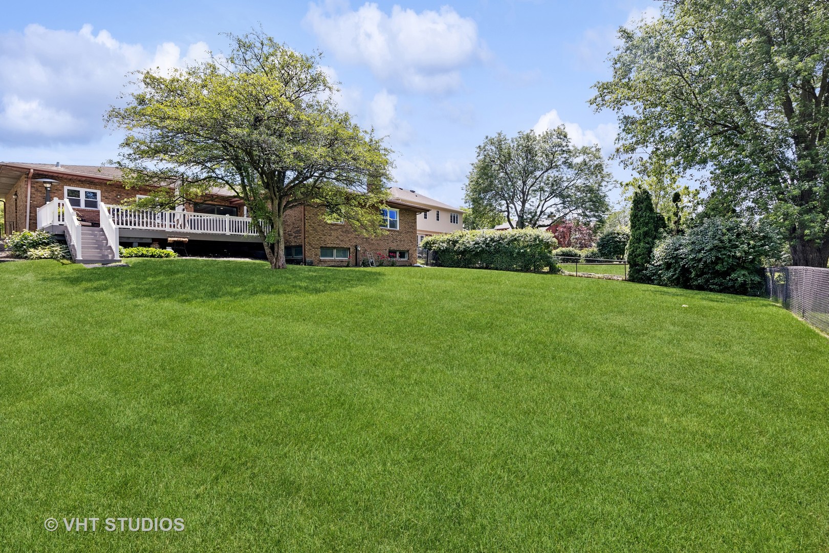 8460 Dolfor Cove Burr Ridge, IL 60527 - Photo 28 of 32 a front view of a house with a garden
