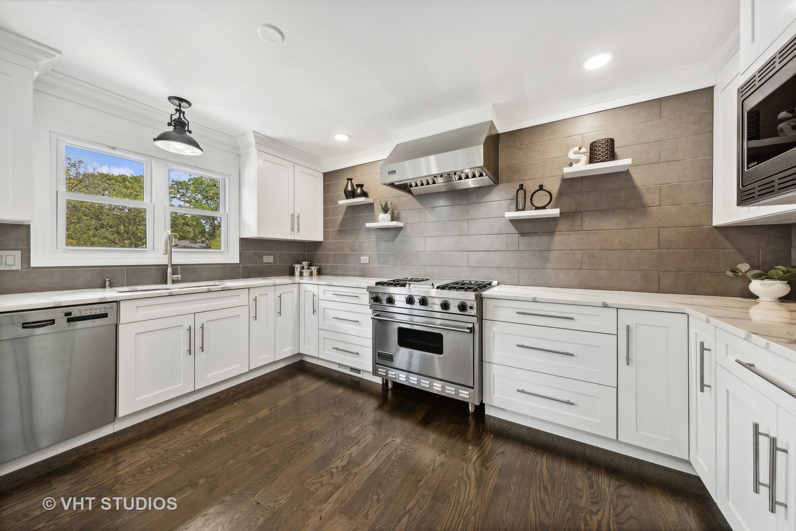 8460 Dolfor Cove Burr Ridge, IL 60527 - Photo 4 of 32 a kitchen with granite countertop white cabinets and white stainless steel appliances