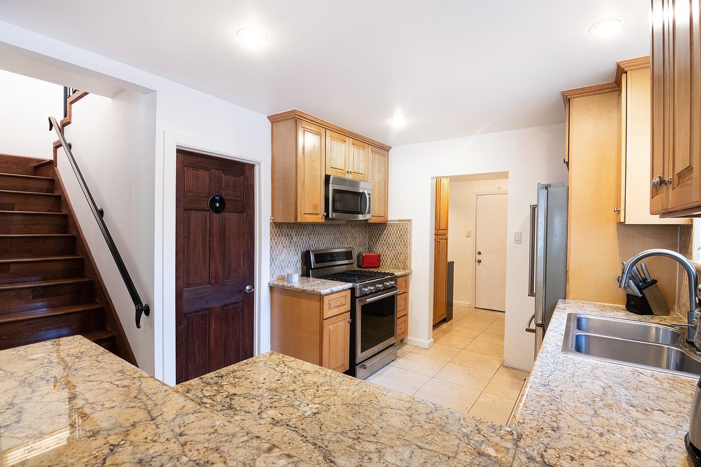 1935 Summit Avenue Pasadena, CA 91103 - Photo 15 of 27 a view of a kitchen with sink stove and refrigerator