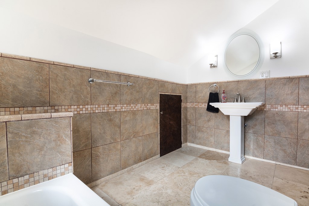 1935 Summit Avenue Pasadena, CA 91103 - Photo 19 of 27 a bathroom with a sink and a mirror