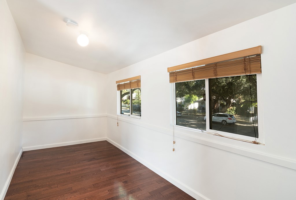 1935 Summit Avenue Pasadena, CA 91103 - Photo 22 of 27 an empty room with wooden floor and windows