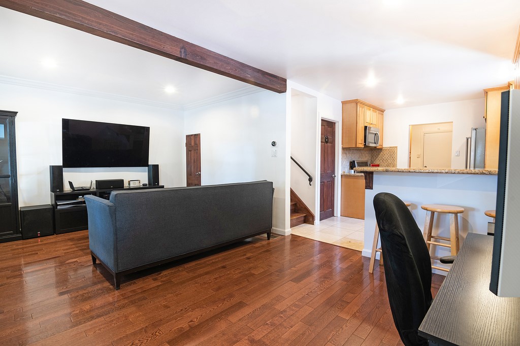 1935 Summit Avenue Pasadena, CA 91103 - Photo 3 of 27 a living room with furniture and a flat screen tv