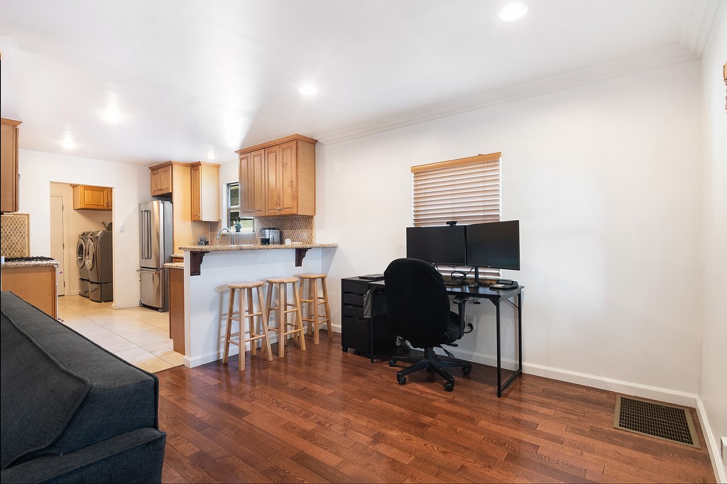 1935 Summit Avenue Pasadena, CA 91103 - Photo 5 of 27 a livingroom with workspace and a couch