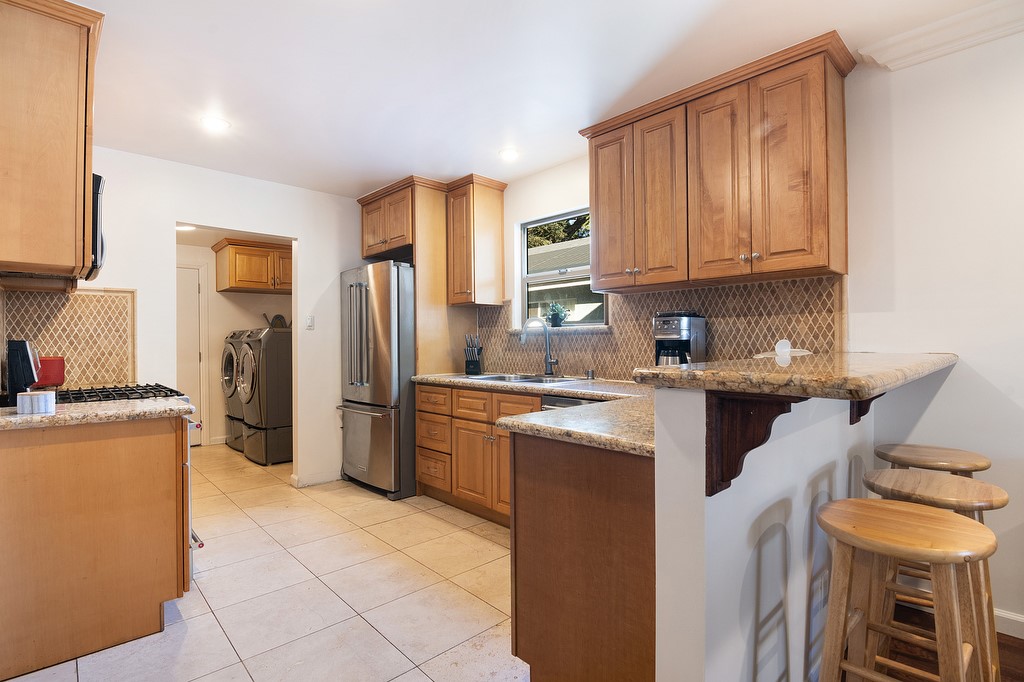 1935 Summit Avenue Pasadena, CA 91103 - Photo 7 of 27 a kitchen with a refrigerator sink and stove