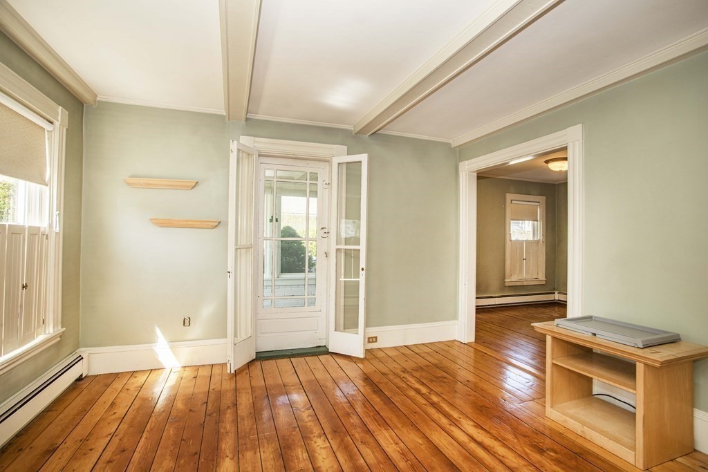 28 Augustine Street Brockton, MA 02301 - Photo 13 of 34 a view of a room with wooden floor and windows