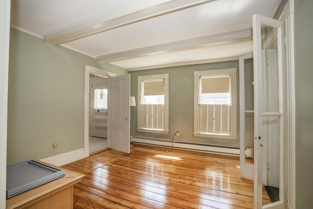 28 Augustine Street Brockton, MA 02301 - Photo 15 of 34 a view of empty room with wooden floor and fan