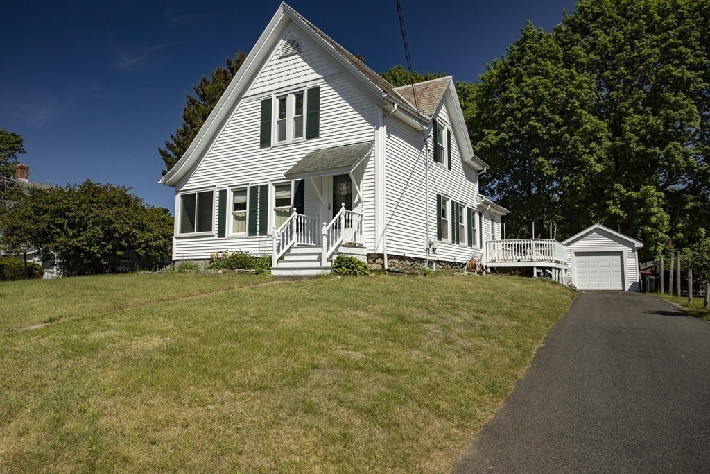 28 Augustine Street Brockton, MA 02301 - Photo 2 of 34 a front view of a house with a yard