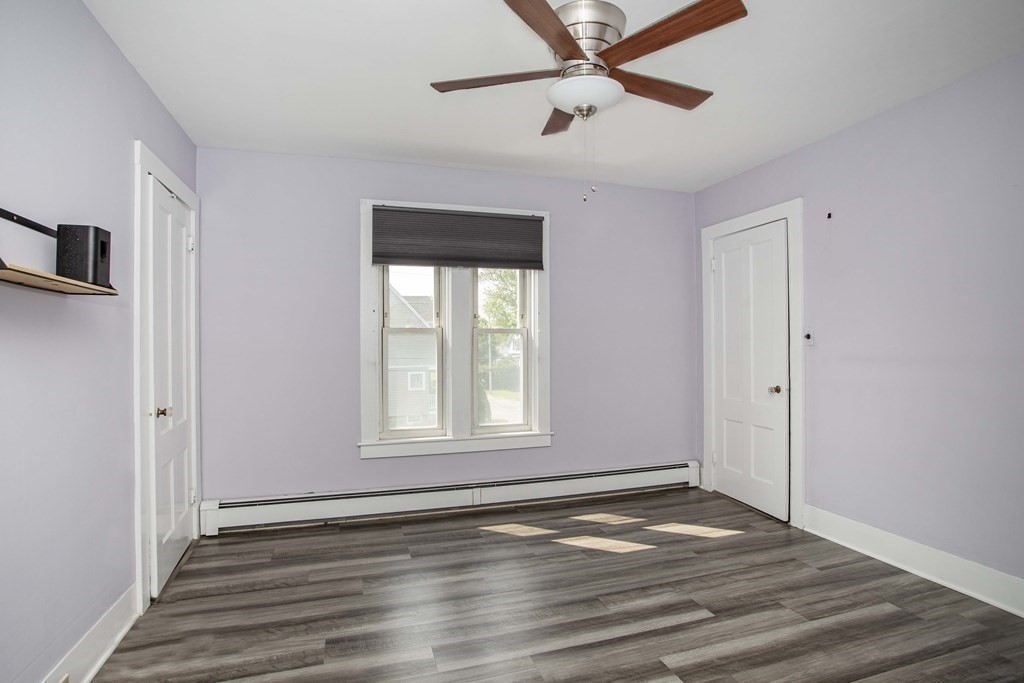 28 Augustine Street Brockton, MA 02301 - Photo 24 of 34 wooden floor in an empty room with a window