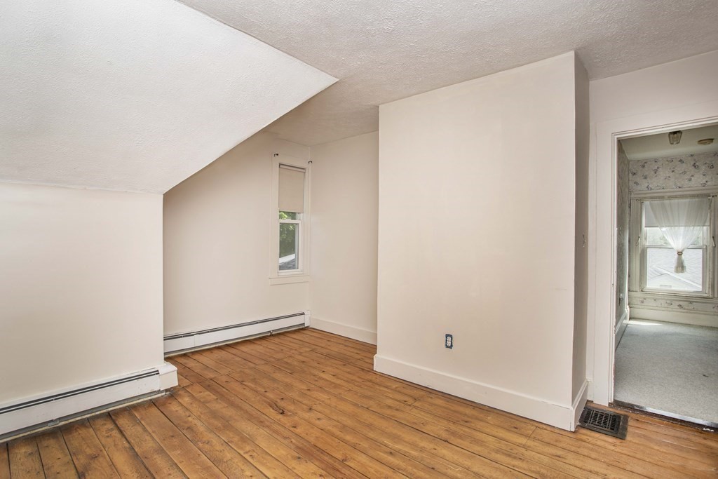 28 Augustine Street Brockton, MA 02301 - Photo 29 of 34 wooden floor in an empty room