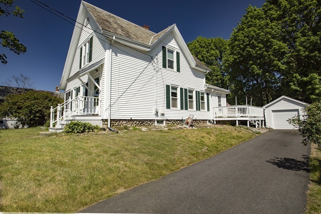 28 Augustine Street Brockton, MA 02301 - Photo 3 of 34 a front view of a house with a yard