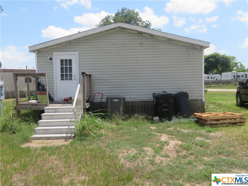 191 Refugio Street La Ward, TX 77970 - Photo 3 of 7 a front view of a house with a yard