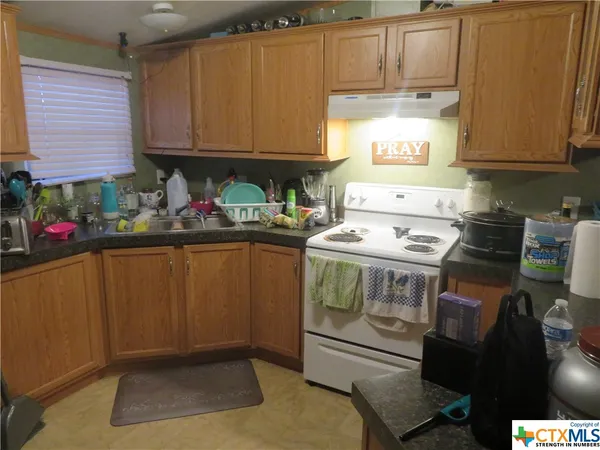 a kitchen with a cabinets and appliances