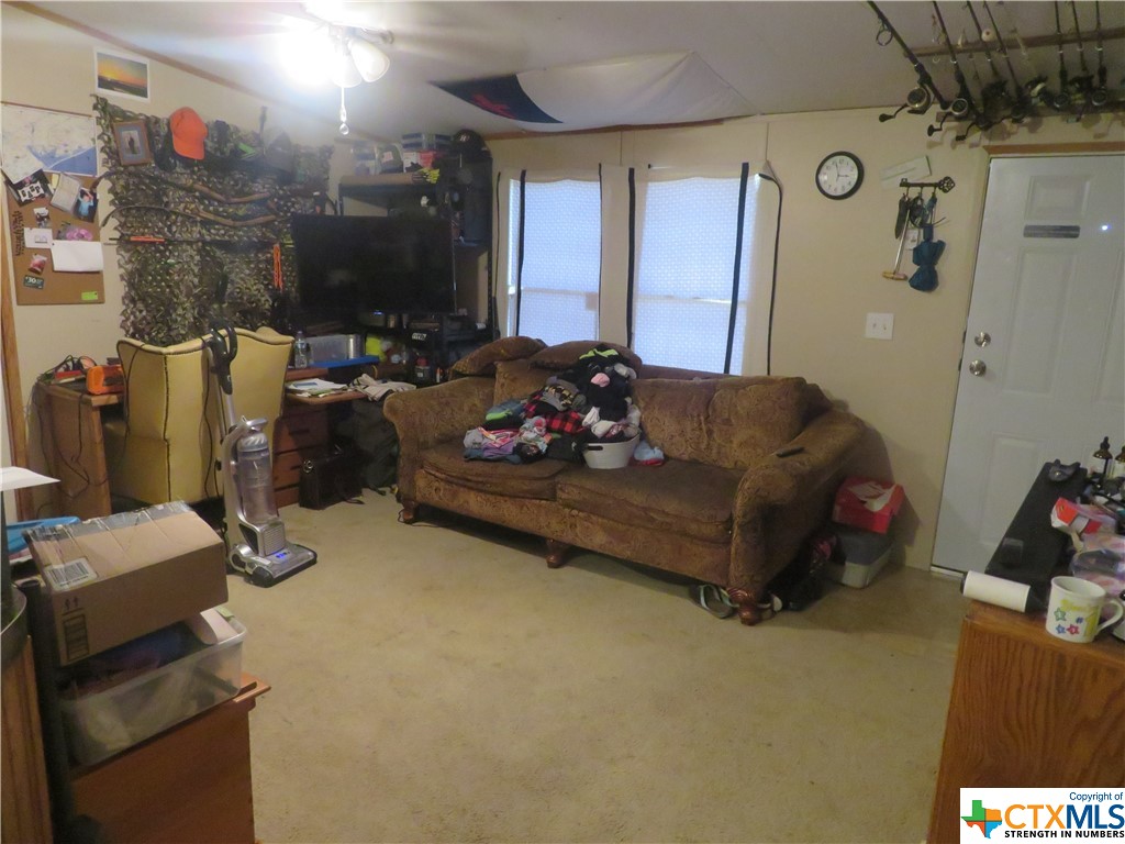 191 Refugio Street La Ward, TX 77970 - Photo 5 of 7 a living room with furniture and a flat screen tv