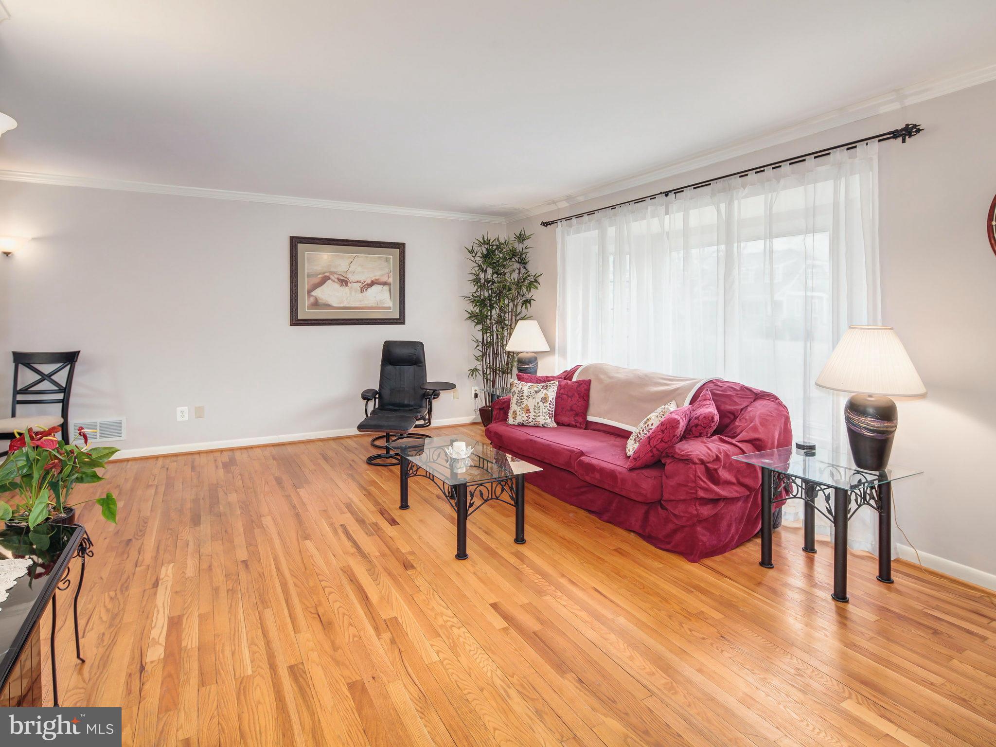 5808 Greentree Road Bethesda, MD 20817 - Photo 3 of 26 a living room with furniture and a wooden floor