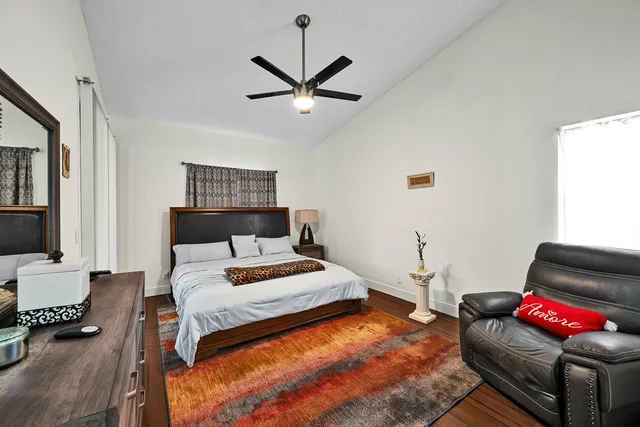 an aerial view of a residential houses with yard