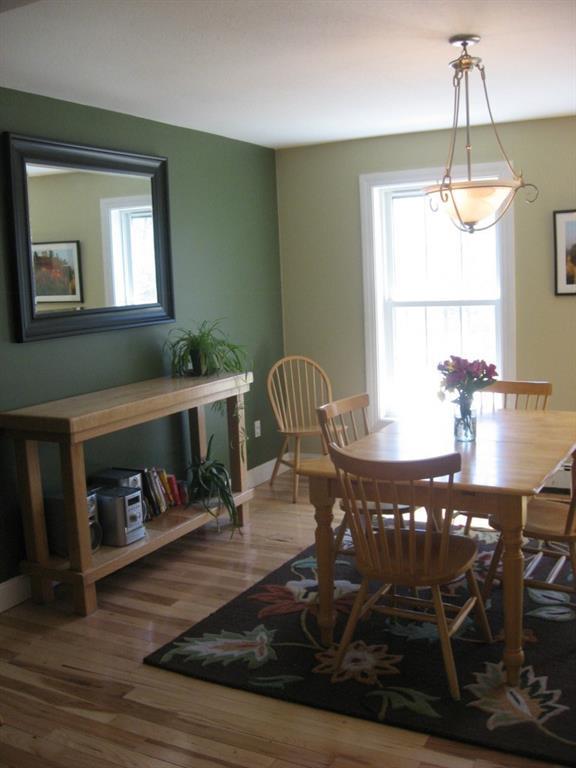 35 New Road Lovell, ME 04051 - Photo 7 of 35 Gleaming wood floors in the dining room.