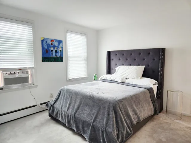 a view of an empty room and bedroom