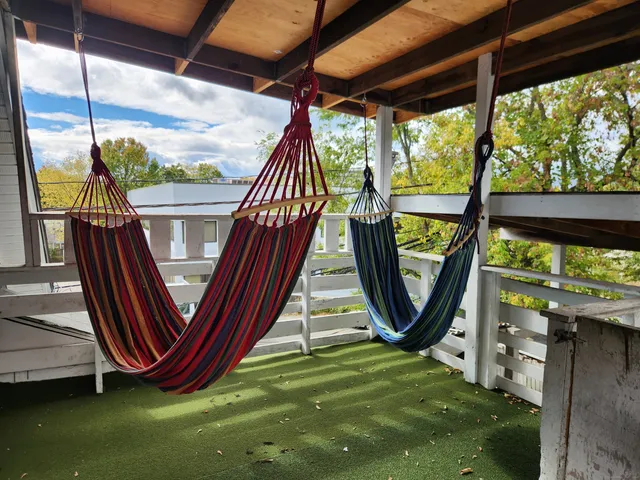 a backyard of a house with outdoor seating