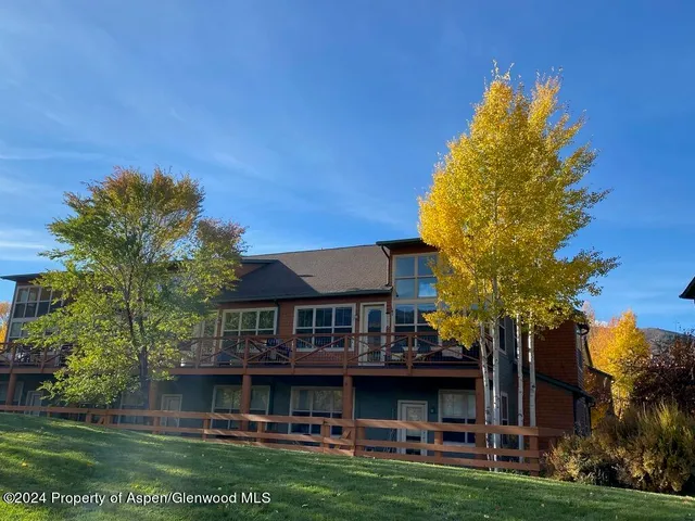 a view of house with yard