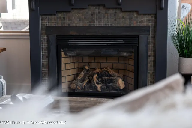 a kitchen with a fireplace in it