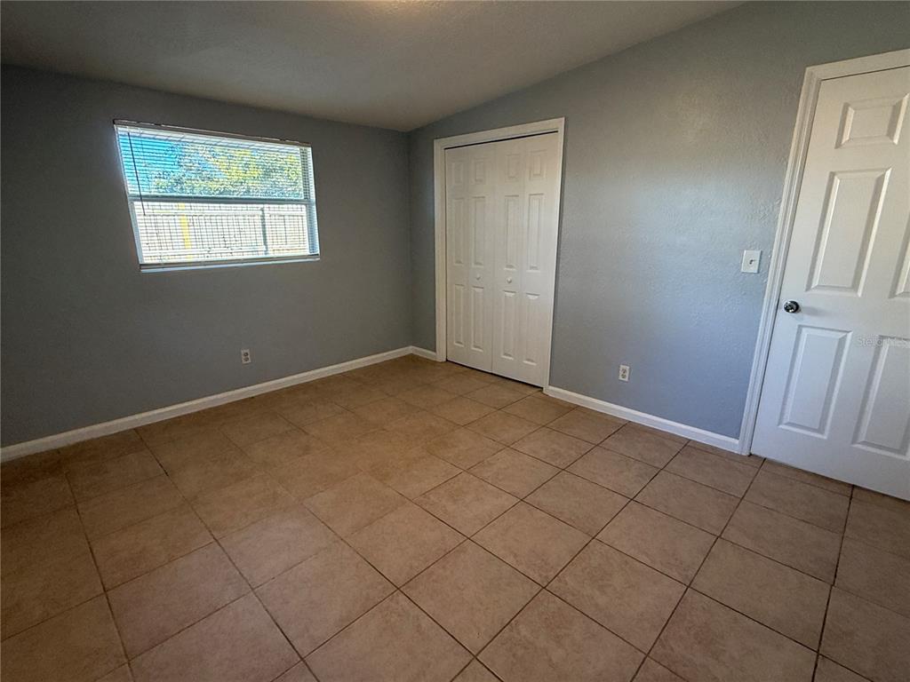 4117 Highland Loop New Port Richey, FL 34652 - Photo 3 of 12 an empty room with windows
