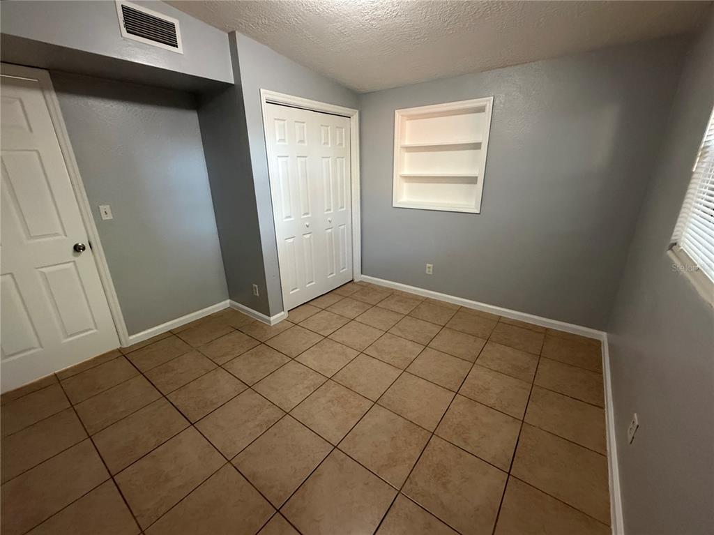 4117 Highland Loop New Port Richey, FL 34652 - Photo 4 of 12 an empty room with windows